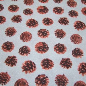 Tobozok halványkék alapon hópelyhekkel